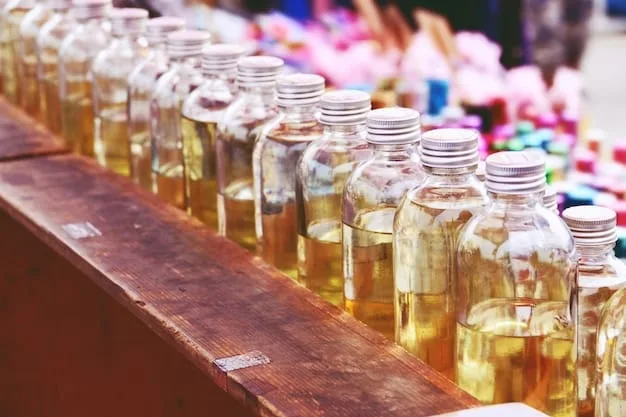 A diverse array of perfume testers laid out on a well-lit counter in a perfumery. Hands are reaching in to pick up and smell different fragrance samples.