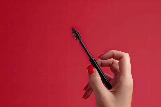 A close-up of a makeup artist's hands demonstrating the use of a lash applicator to carefully place false eyelashes on a client in a salon in Germany. The focus is on the precision and technique involved in the application process.