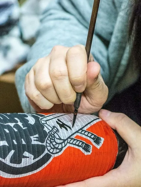 A close-up shot of a designer's sketchpad, showcasing initial designs for the Nike x German Designers collaboration. The sketches feature intricate patterns and innovative material usage, hinting at the collection's unique aesthetic.