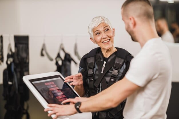 A German runner being fitted for running shoes at a specialty running store in Germany. The runner is on a treadmill, and the store employee is analyzing their gait.