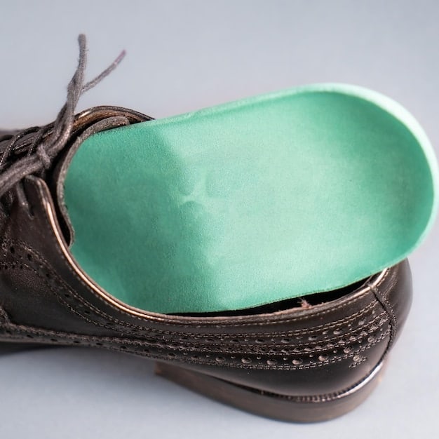 A detailed view of a shoe insert highlighting its arch support and heel cushioning features. The insert is positioned inside a running shoe, demonstrating how it fits and provides support.