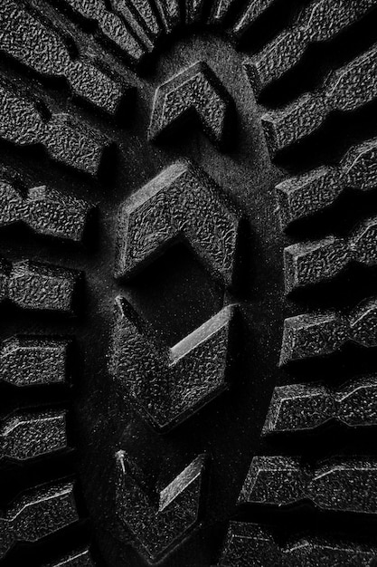 A close-up of a hiking boot sole showing deep lugs and aggressive tread pattern designed for excellent traction on various terrains.