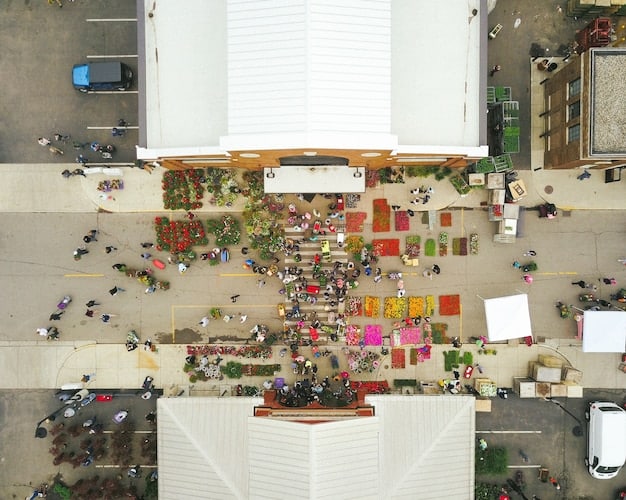 An aerial view of a sneaker convention in Cologne, Germany, with rows of tables displaying various sneakers, collectors trading shoes, and enthusiasts admiring rare models. The image captures the passion and community within the German sneaker collecting scene.
