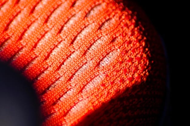 A close-up of Adidas Boost midsole, showcasing the individual TPU capsules fused together. The image should highlight the material's texture and the way it compresses and rebounds under pressure.