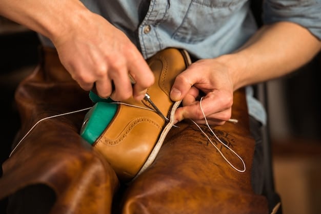 A craftsman's hands carefully inspecting the stitching on a high-quality leather shoe. The focus is on the fine details of the stitching and the texture of the leather. The background shows a workshop with various tools and materials used in shoemaking.