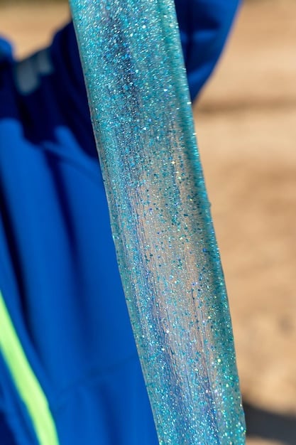 A close-up shot of Nike Dri-FIT fabric, highlighting its moisture-wicking properties. Water droplets are visible on the fabric's surface, showcasing how it repels moisture. The texture of the fabric is clearly visible, emphasizing its advanced construction and breathability.