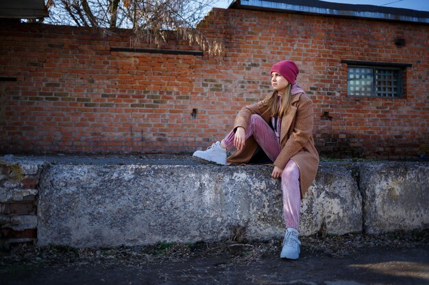 A street-style shot featuring a German sneakerhead wearing a pair of Nike retro sneakers. The focus is on the overall outfit, showcasing how the retro sneakers complement the individual's style and personality. The background is a vibrant urban environment in Berlin, highlighting the city's fashion-forward culture.