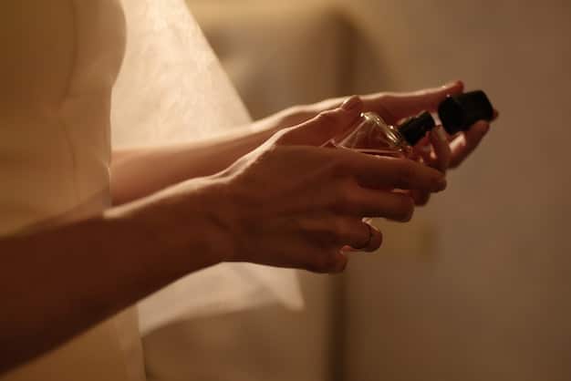 A detailed shot of a woman's hands applying perfume to her neck, highlighting the pulse point and the gentle touch, with a blurred background showcasing luxury perfume bottles.