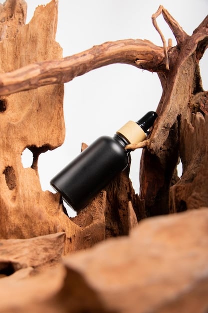 A close-up shot of a perfume bottle with an intricate wooden cap, showcasing the blend of natural and sophisticated design elements. The background is blurred, with hints of greenery and a soft, diffused light emphasizing the connection to nature.