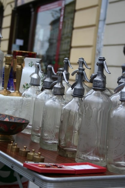 A diverse collection of perfume bottles displayed on a shelf, each distinctly labeled with an occasion (e.g., 