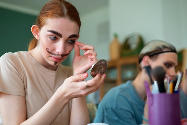 A makeup artist demonstrates blending eyeshadow on a model's hooded eyes, using a fluffy brush and soft brown shades to create a diffused smokey effect. The model's eyes are open, allowing viewers to see how the eyeshadow looks in a natural, forward-facing view.