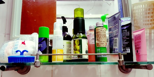 A shelf showcasing various makeup removers specifically labeled for sensitive skin, arranged neatly with informative tags highlighting key comforting and gentle ingredients.