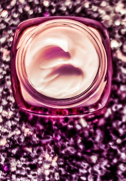 Close-up of skincare products being applied: cleanser, serum, moisturizer. The focus is on the texture and consistency of the products, emphasizing their hydrating and smoothing properties. A hand gently applies the product to the skin, showcasing a mindful skincare routine.