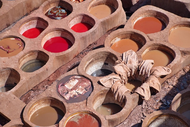 A display of various concealers from different brands, with close-ups highlighting the textures and consistencies of liquid and cream formulations. Each product should be clearly labeled, and the image should showcase a range of shades.