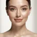 Woman with radiant, natural skin showcasing the 'no-makeup' makeup look.