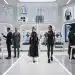 Futuristic fashion studio with digital design screens and personalized apparel creation